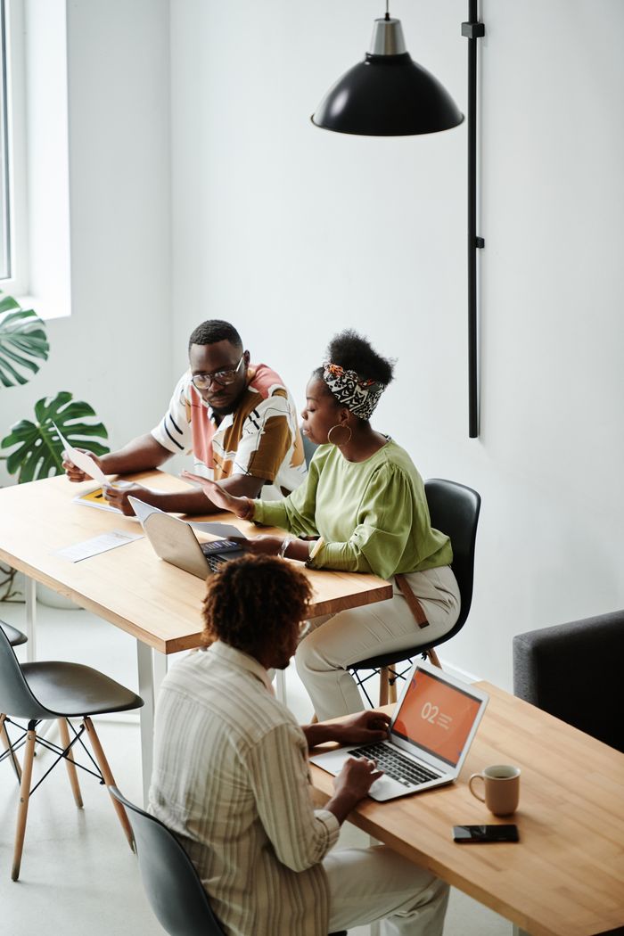 The Art of Drawing Readers In: Your attractive post title goes here Diverse team working together in a modern, bright office space.